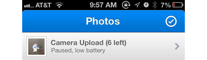 Dropbox - iOS app automatically pauses Camera Upload when the battery is running low.